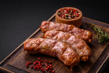 Delicious juicy grilled chicken or pork sausages with salt, spices and herbs