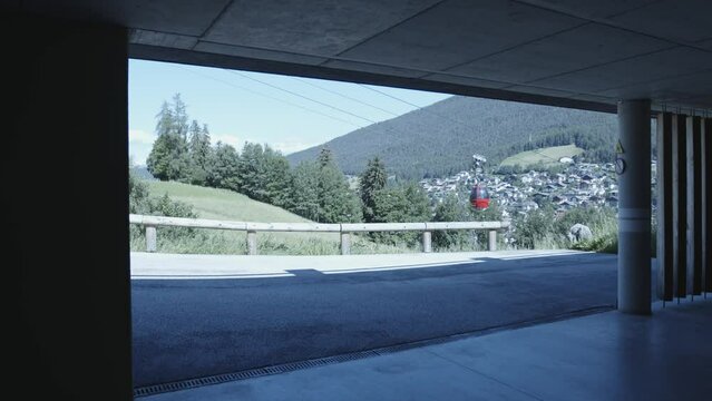 Gondolas going up and coming down a ski hill in the summer. Wolkenstein, Italy