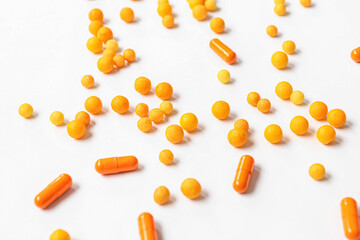 Many different pills on white background