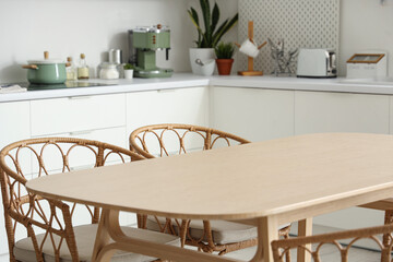 Clean wooden table in interior of modern kitchen