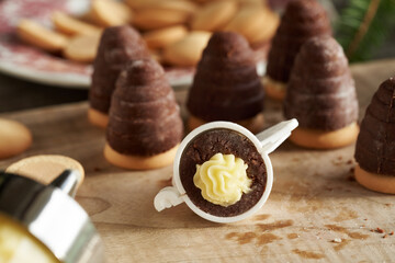 Fillling wasp nests, traditional Czech Christmas cookies, with eggnog cream