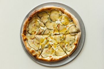 Delicious pizza with crispy sides, pear and truffle. Food photography, menu, mockup.