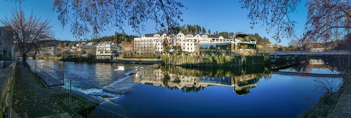 Panoramic view of the thermal area of S. Pedro do Sul, Vouga River and buildings on the banks of the river supporting thermal spas, hotels and others, Viseu, Portugal - obrazy, fototapety, plakaty