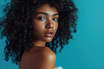 Glowing model girl with black curly hair.