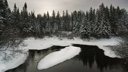 A hike along the Old Railway Bike Trail during winter at Madawaska River in Algonquin Park, Ontario