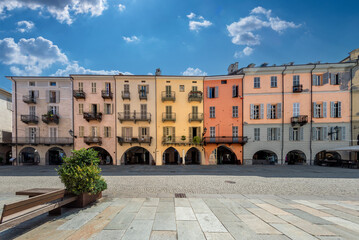 Cuneo, Piedmont, Italy - August 16, 2023: Cityscape on Via Roma, main cobblestone pedestrian street with colorful old buildings and with arcade in historic center - obrazy, fototapety, plakaty