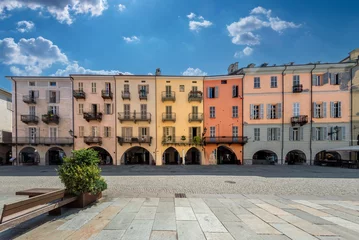 Fotobehang Cuneo, Piedmont, Italy - August 16, 2023: Cityscape on Via Roma, main cobblestone pedestrian street with colorful old buildings and with arcade in historic center © framarzo