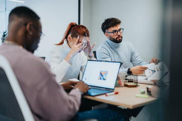 Group of professionals collaborating in a corporate office
