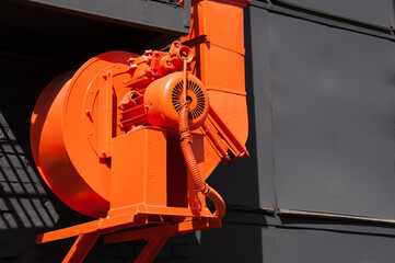 External industrial orange engine with a turbine for extracting exhaust air, heat and moisture from...