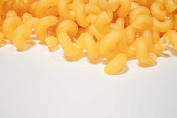 close up of italian pasta on white background with space for text