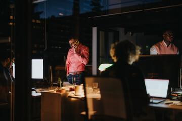 A cross-generational team collaborates late at night in the office, discussing business growth, sales, and marketing strategy. Their teamwork leads to corporate success.