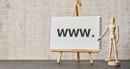 There is notebook with the word WWW.. It is an abbreviation for World Wide Web as eye-catching...
