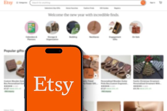 Modern smartphone shows app Etsy Logo, online marketplace, website of the trading platform behind, sales platform, e-commerce, internet, shipping