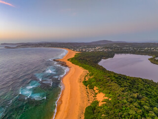 Summer sunrise at the seaside bay