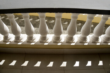 columns in the city, detail of a building, detail of a balcony, architectural balusters background,...