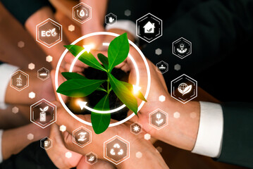 Business partnership nurturing or growing plant together with carbon icon symbolize ESG sustainable...