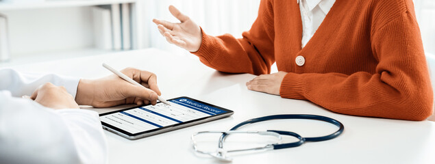 Patient attend doctor's appointment at clinic or hospital office, discussing medical treatment...
