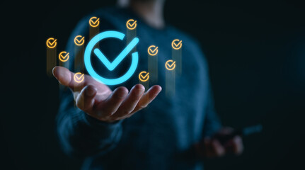 Service guarantee, clients service, businessman hand showing guarantee check mark for business automation process, quality assurance management, certification, online shopping, financial ecosystem.