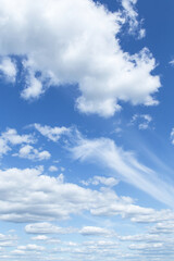 Many white fluffy clouds against beautiful blue sky background