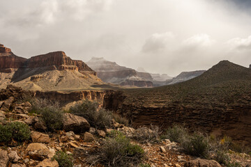 Snow Covers Peaks and Pyramds in the Distance in the Grand Canyon
