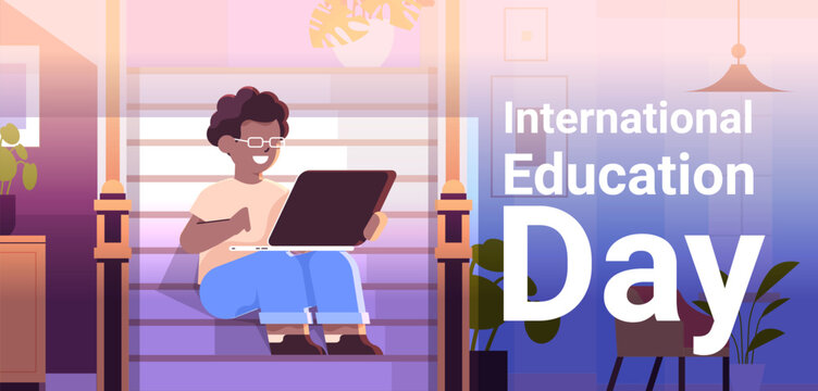 student watching free online courses on laptop international education day live webinar e-learning concept living room interior