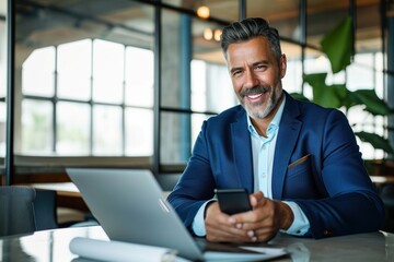 Smiling mid aged business man ceo wearing blue suit sitting in office using cell phone solutions. Mature businessman professional executive holding mobile working at desk with laptop, Generative AI