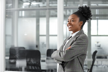 Happy woman with crossed arms in office, space for text. Lawyer, businesswoman, accountant or manager - obrazy, fototapety, plakaty