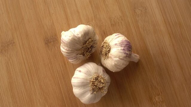 Garlic in Rotation on Wooden Background
