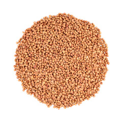 Many dry buckwheat grains isolated on white, top view