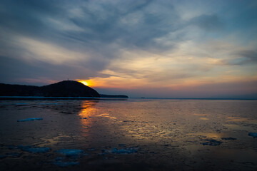 Beach in winter. Winter walks at sea.