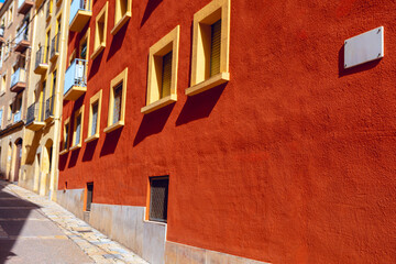 House with red wall and yellow windows . Colorful facades of houses in the old town of Strasbourg, France