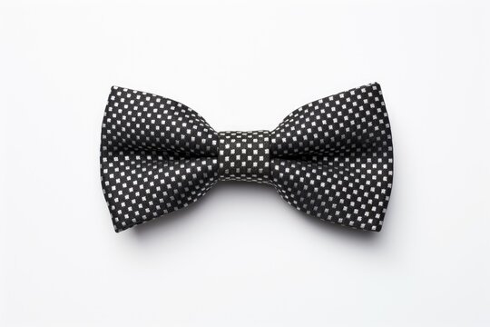 Black bow tie against a white backdrop