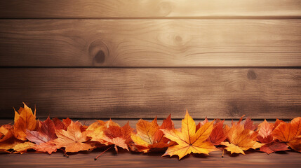 Naklejka na ściany i meble orange autumn leaves on wooden background