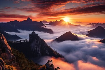 Naklejka premium Mountain at dawn surrounded by clouds