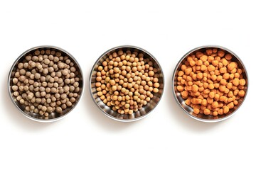 Three dry pet food dishes in a metal bowl isolated on white background viewed from the top front and half