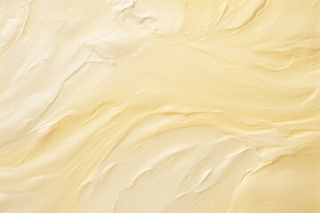 Vanilla cream smear on textured beige background