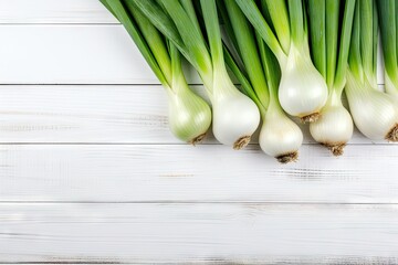 White wooden background with leek and vegetables top view free space