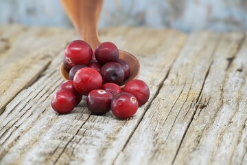 Kitchen scene with fresh cranberries on rustic table
