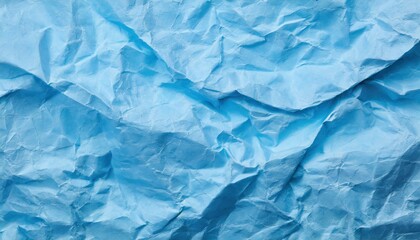 Obraz premium The blue crumpled paper background.