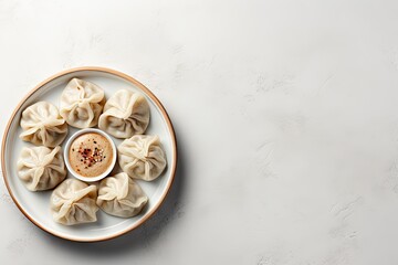 Georgian cuisine s traditional set of Khinkali dumplings on white stone viewed from the top with space for text - obrazy, fototapety, plakaty
