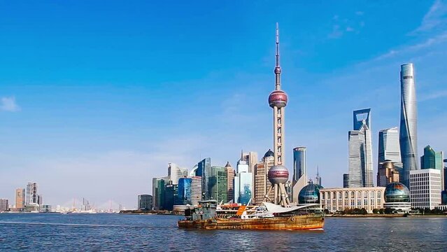 Shanghai bund skyline lujiazui timelapse in a clear day with blue sky.