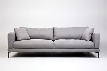 Grey sofa on carpet isolated on white background in studio