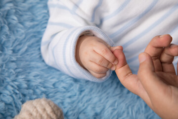 Newborn baby little hands body part affection motherhood