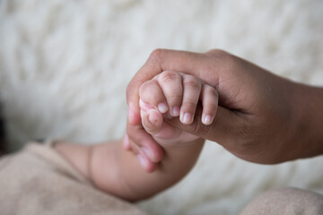 Newborn baby little hands body part affection motherhood