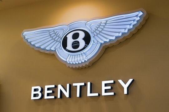 Logo Bentley On A Gold Background. Luxury Hybrid Motor Car Show In Thailand Bangkok 21 December 2023.