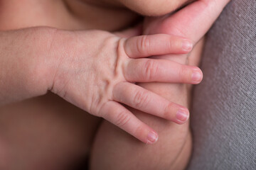 Newborn baby little hands body part affection motherhood
