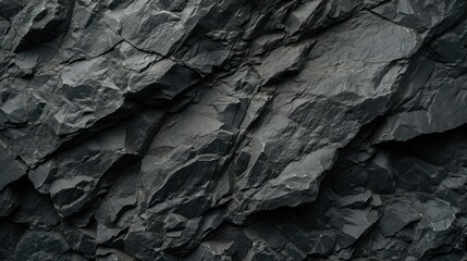 Rock texture background. dark black rough mountain surface. textured stone background with space for design

