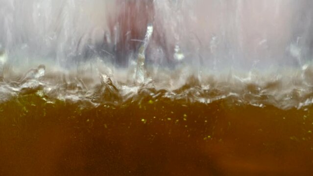 Equipment for pharmaceutical and chemical industry. Media. Close up of liquid inside glass container at the lab.