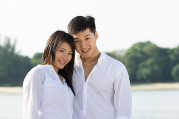 Young Asian couple on the beach