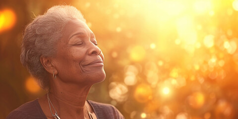 Happy black female smiling in happiness taking deep breath for zen, health or spiritual wellness. Senior African American woman with healing energy light around her feeling good breathing calm peace - obrazy, fototapety, plakaty